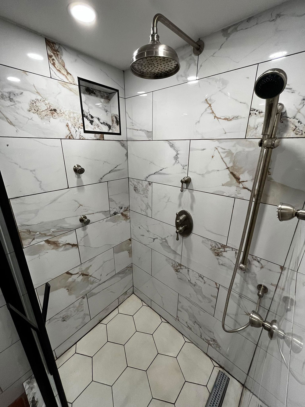 stylish shower with nice looking tiles