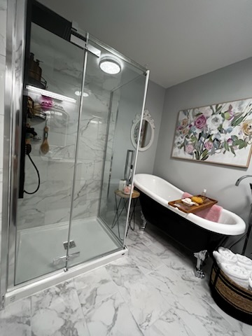 bathroom with clear glass shower enclosure